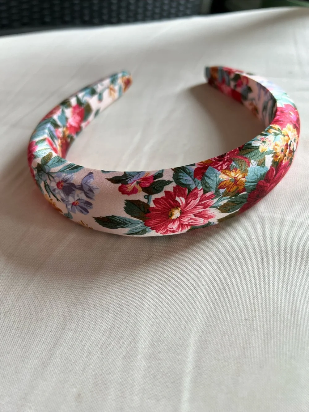Package of six multi-color and brand headbands.